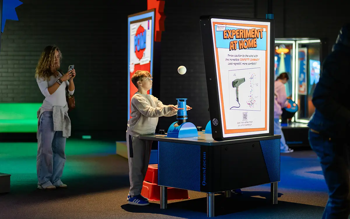 Children playing with Questacon experiments