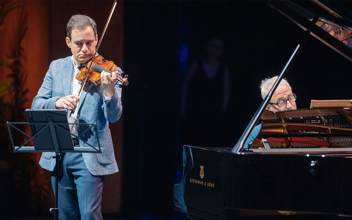 Performers playing violin and piano