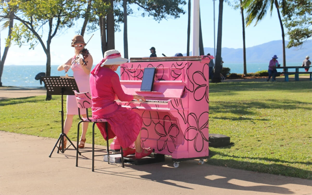 Jan Hynes playing on a pink piano