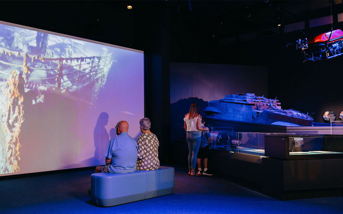 People looking at the Challenging the Deep displays in the museum