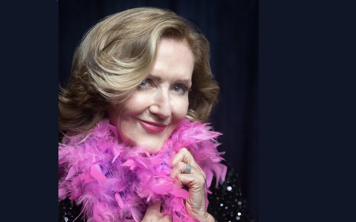 Bernadette Smith wearing a pink feather bower