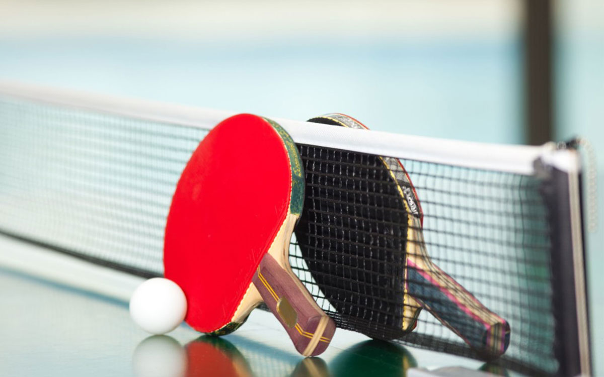 Table tennis rackets sitting on a table