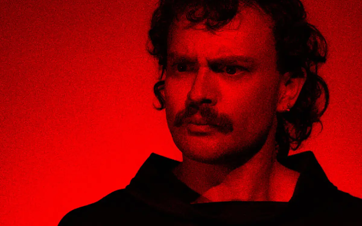 Man with mustache with a red tint
