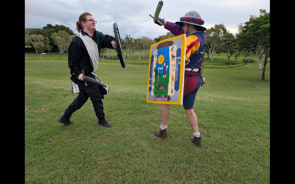 Two swordcraft participants battling