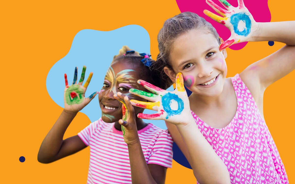 Two girls with paint on their faces and hands