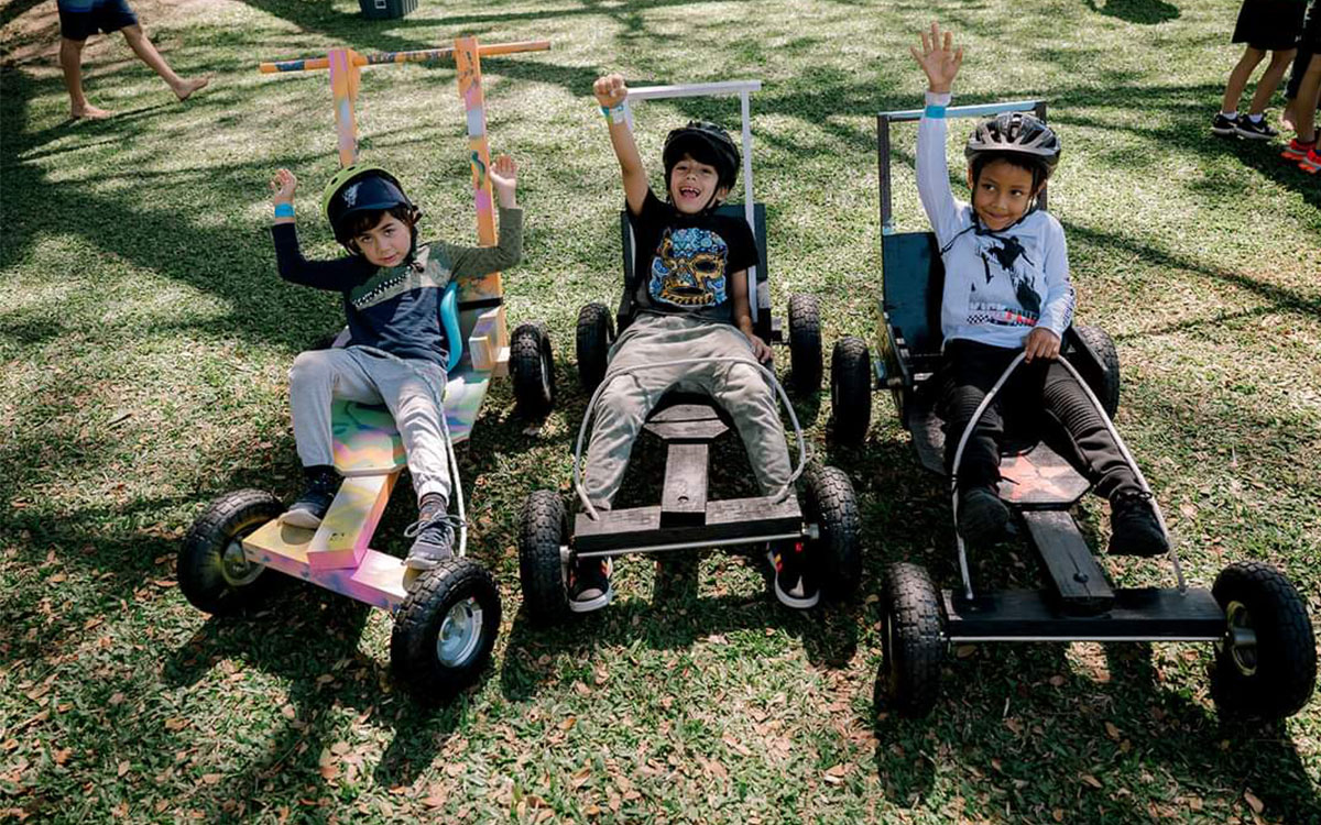 3 boys in billy carts