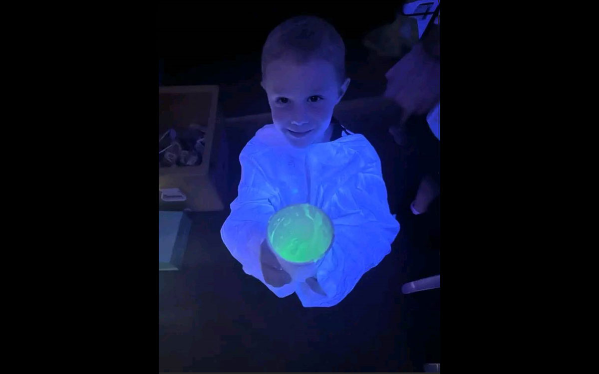 A little boy doing science