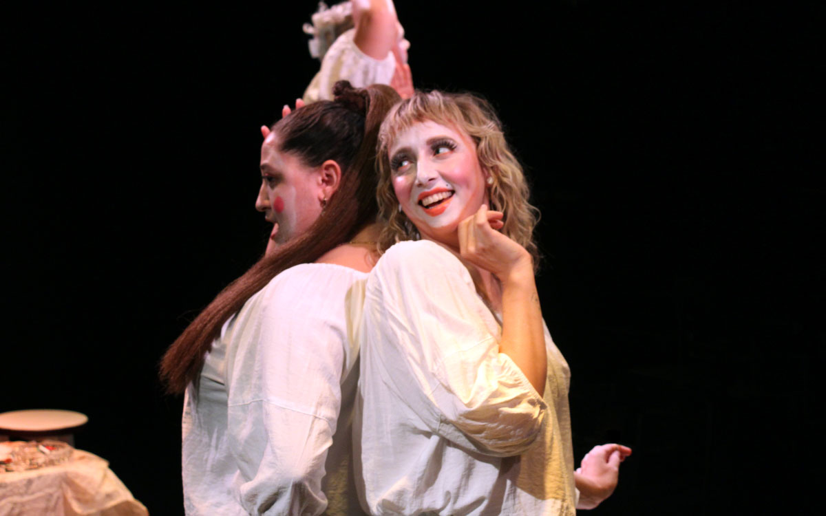 Two female performers on stage