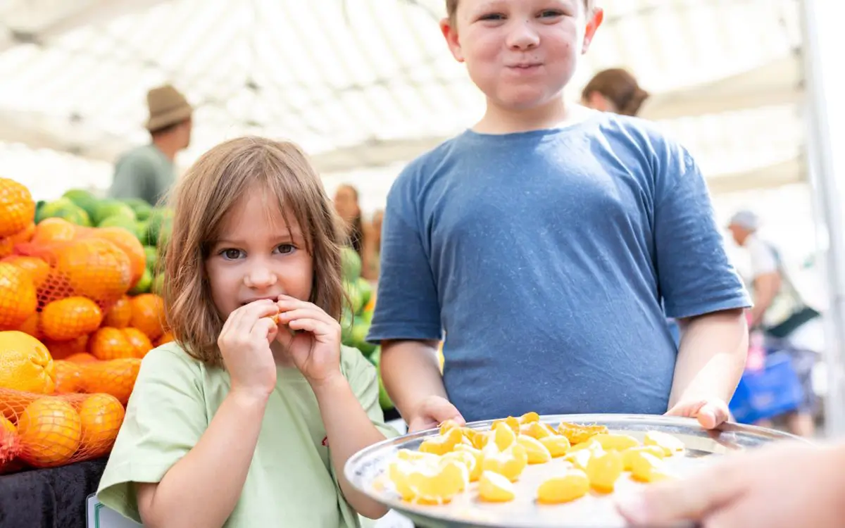 Children eating orange slices
