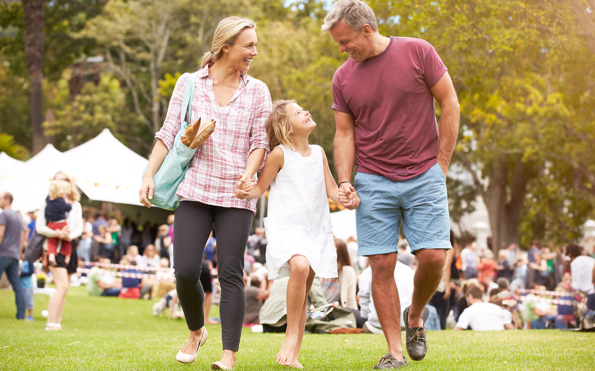 A father, mother and daughter taking a walk