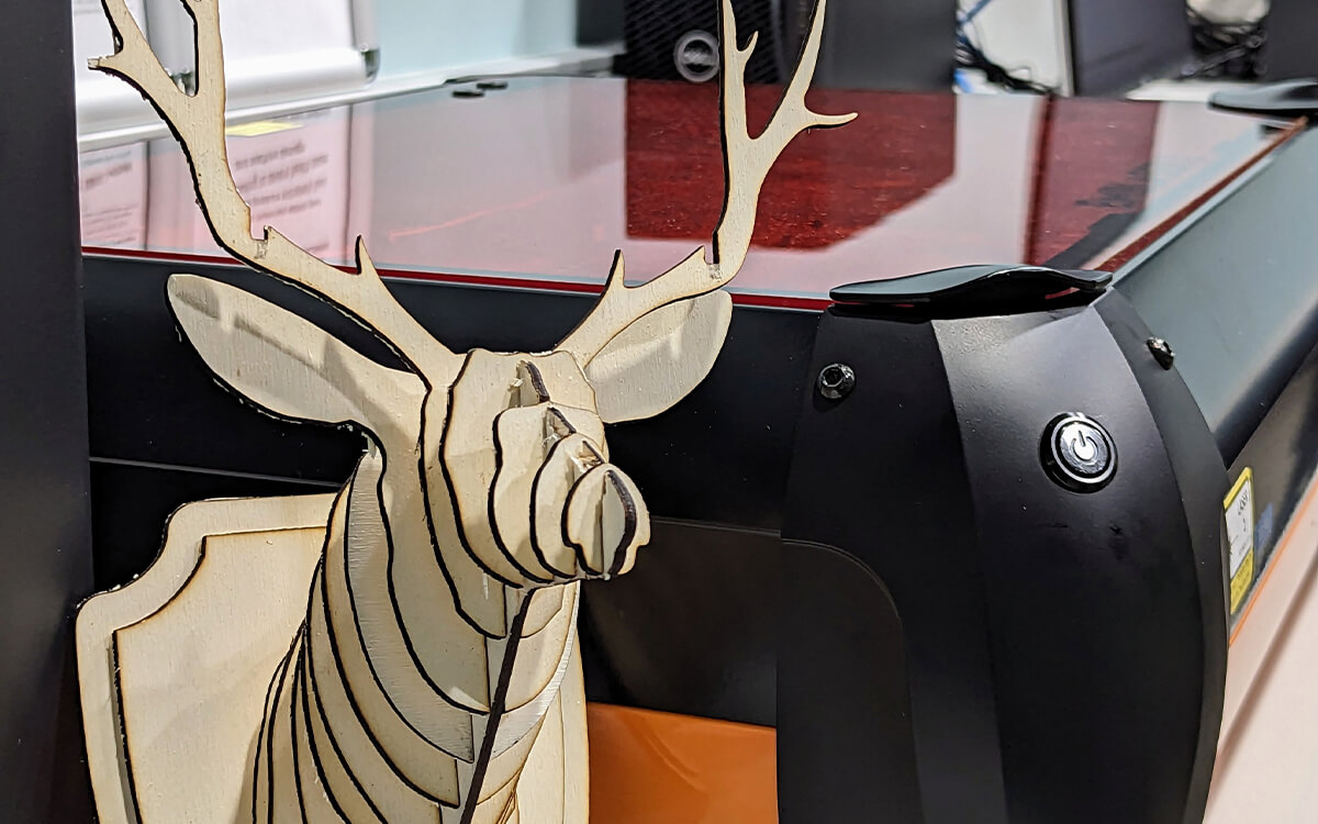 Wooden deer and tools within the Makerspace.