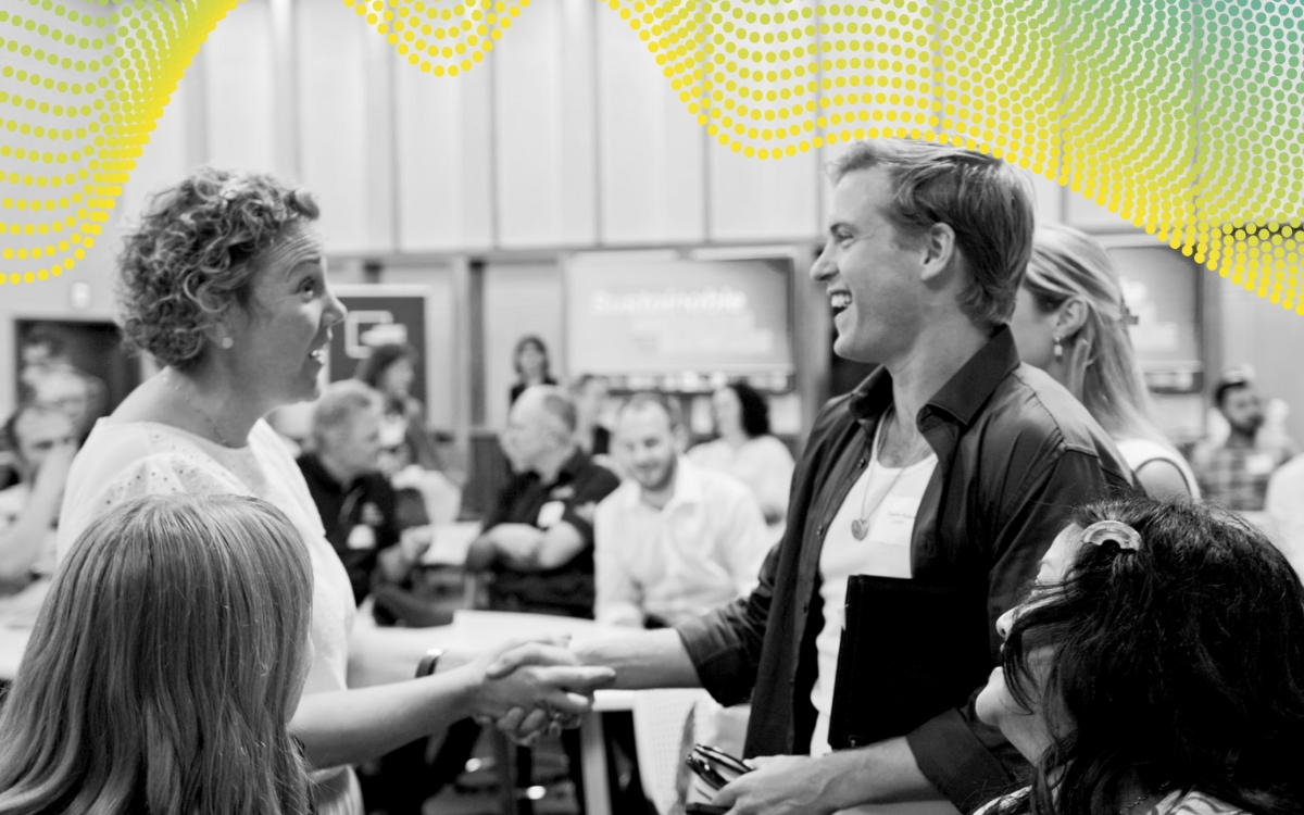 Guest speaker shaking attendees hand
