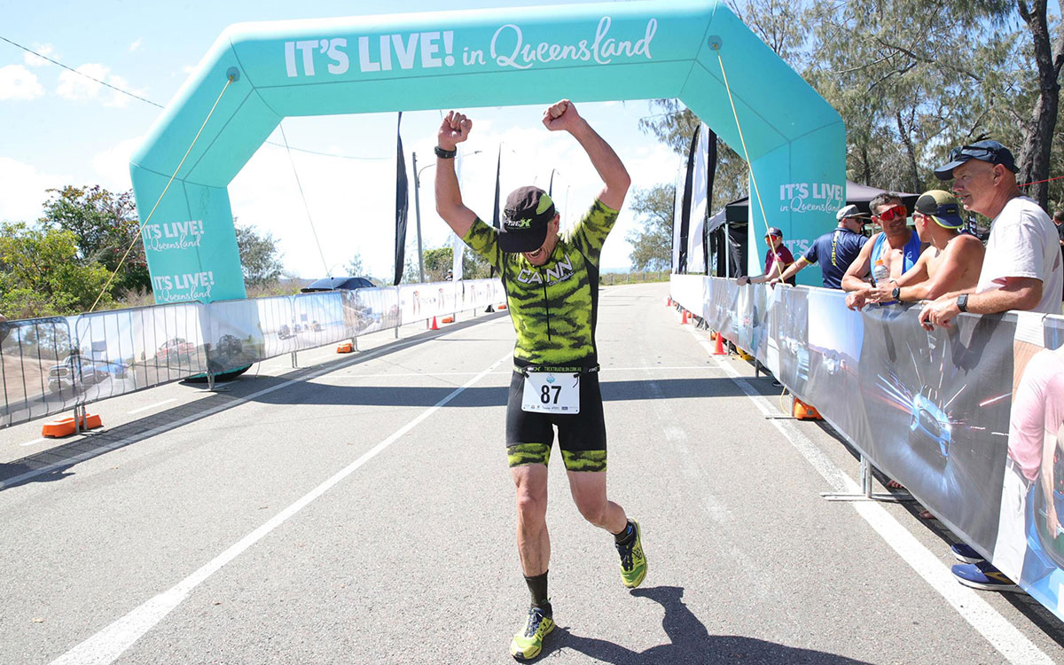 Man celebrating his marathon finish