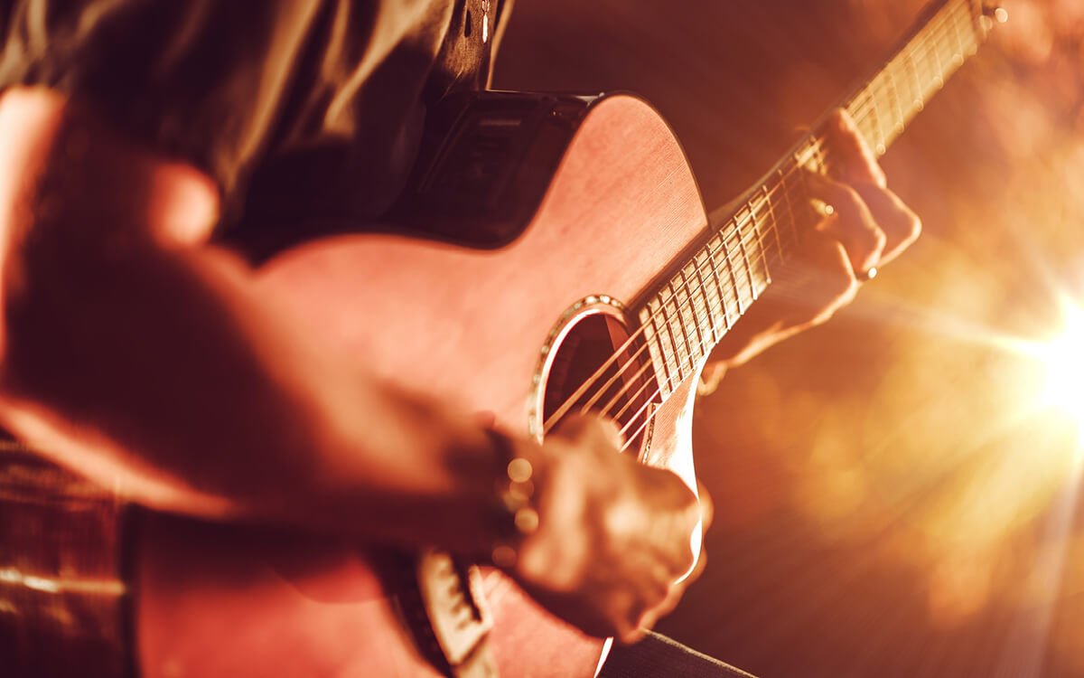 A man playing a guitar