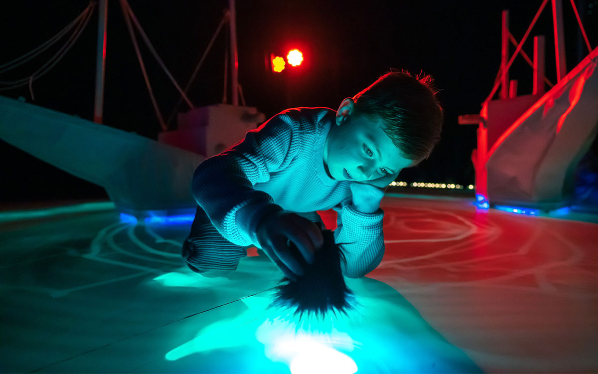 Child playing at sea of light exhibition
