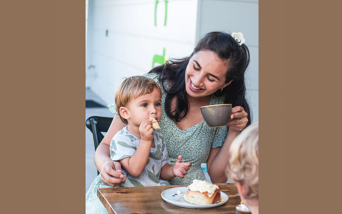 Mother and child eating at the YWAM cafe