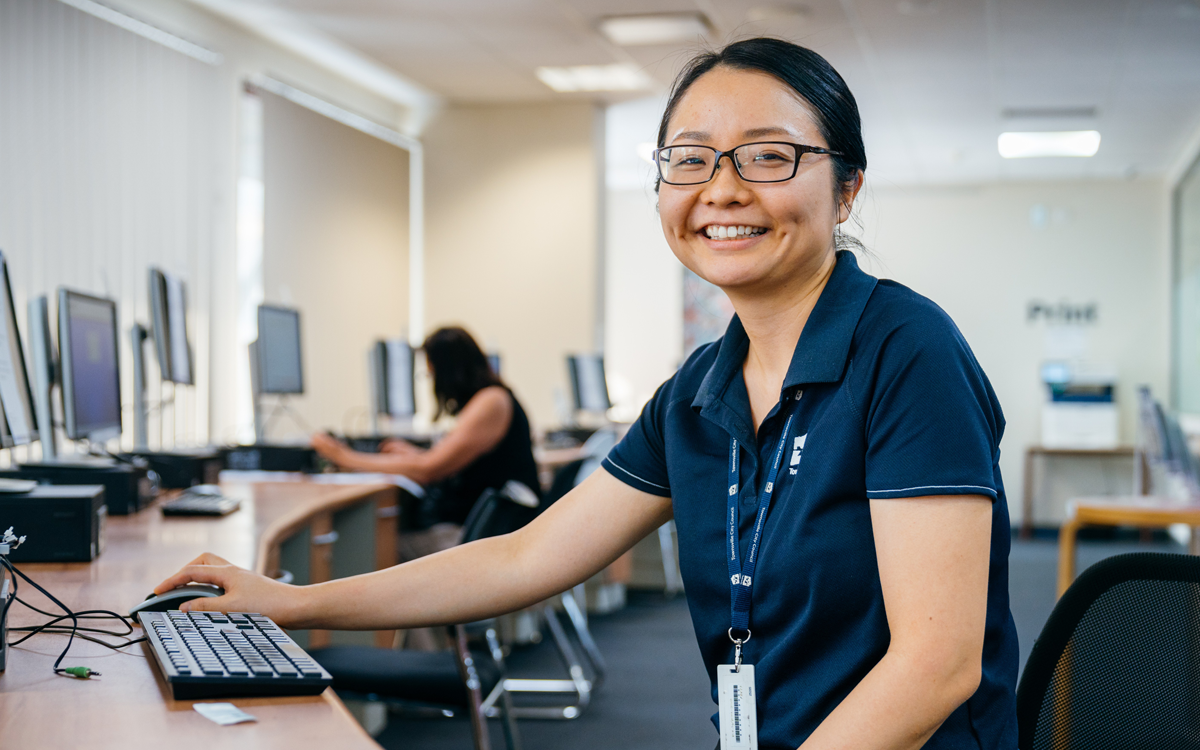 Lady wearing glasses at computer