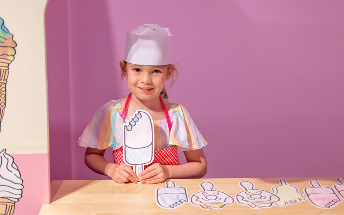 Girl holding coloured-in ice-cream