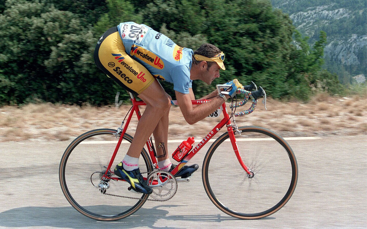 Man riding bike in bike tights and shirt